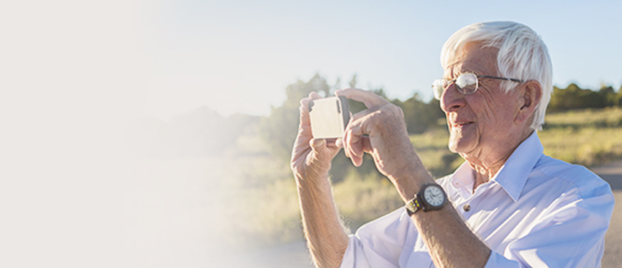 older man taking picture Doctor discussion guide page banner